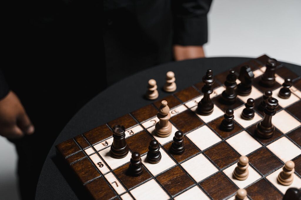 Close-up of a chess game on a wooden board showcasing intricate chess pieces in strategic positions.